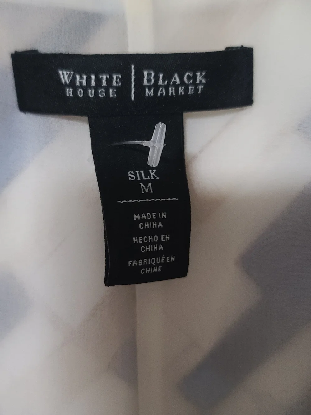 White House Black Market Sleeveless V-Neck Asymmetrical Blue & Tan Print Top